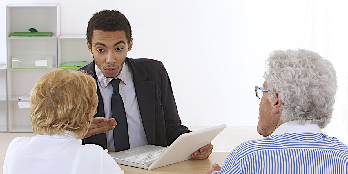 man talking to a couple