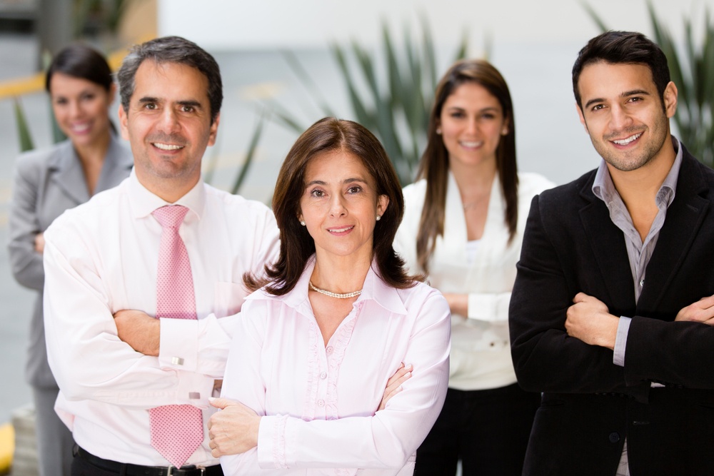 Group of successful business people looking confident