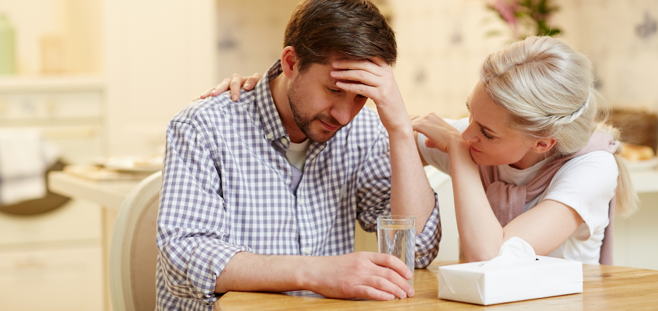 woman consoling man